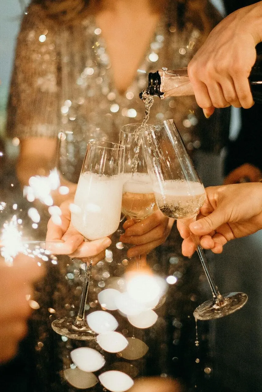 Maid of honor raising a toast at wedding reception